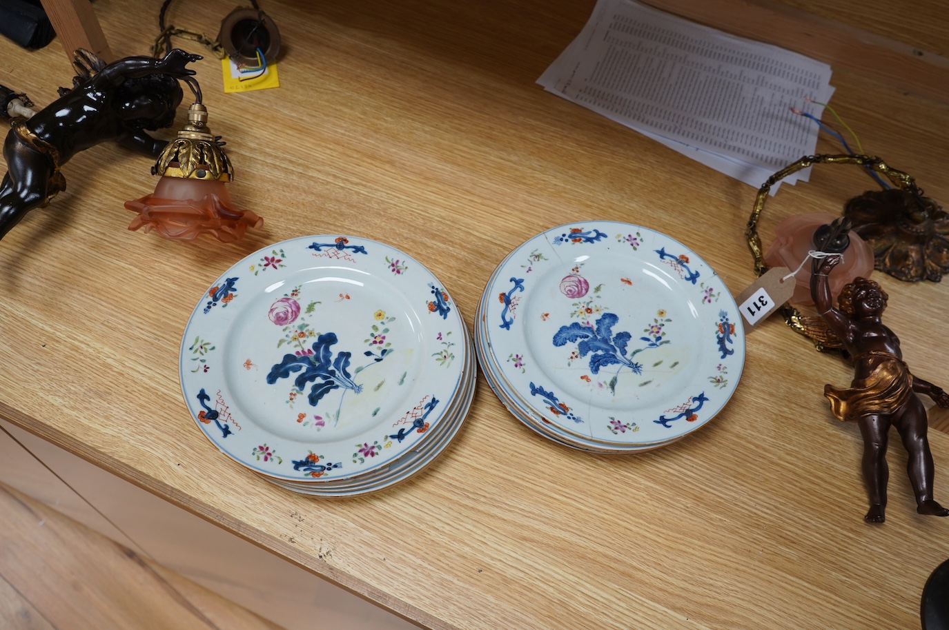 A set of eleven Chinese porcelain ‘’tobacco leaf’’ dishes, (3 cracked), 23cm diameter. Condition - poor.